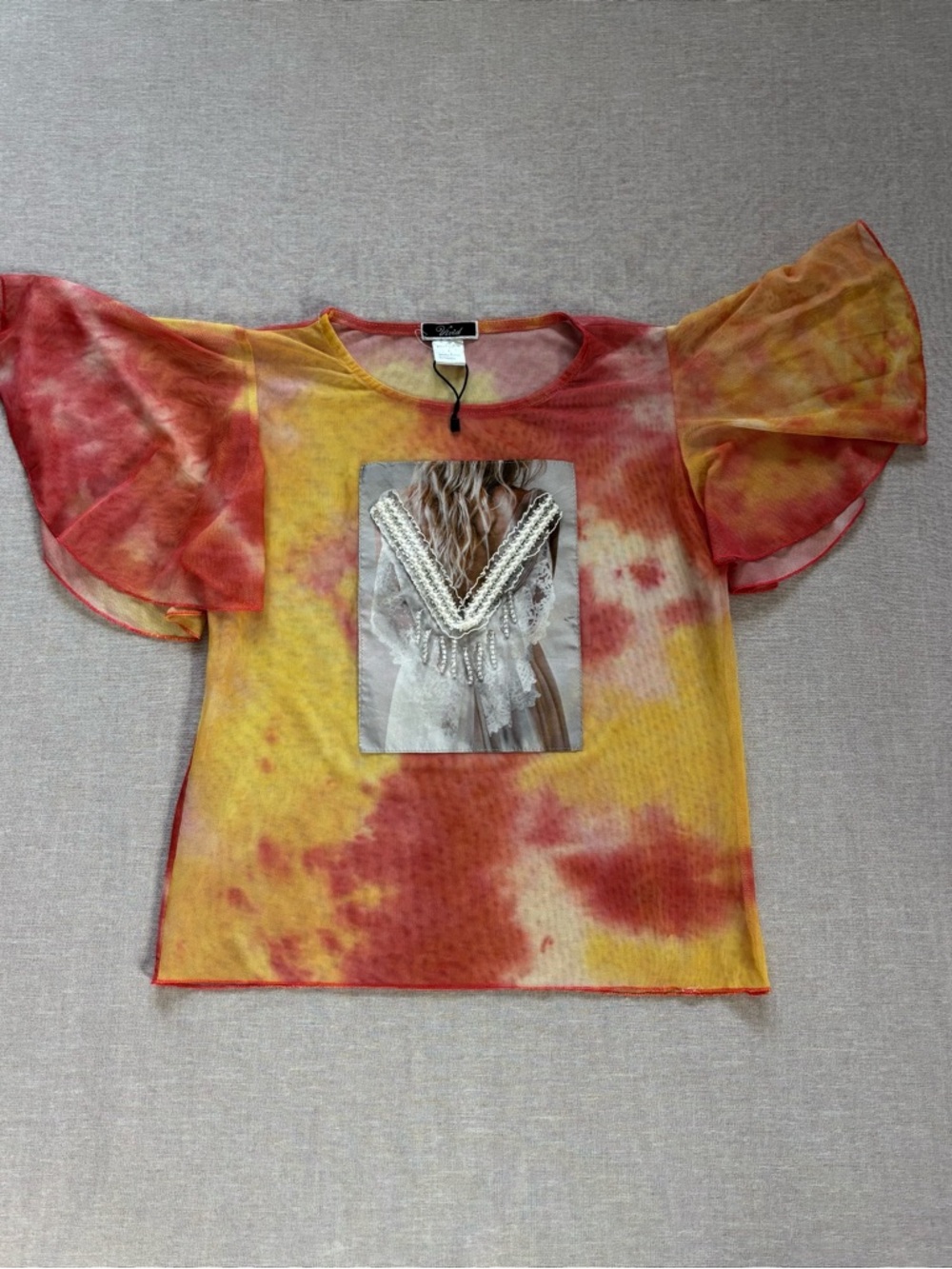 Vivid sheer tie dye beaded top.